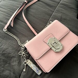 A pink Aldo crossbody bag